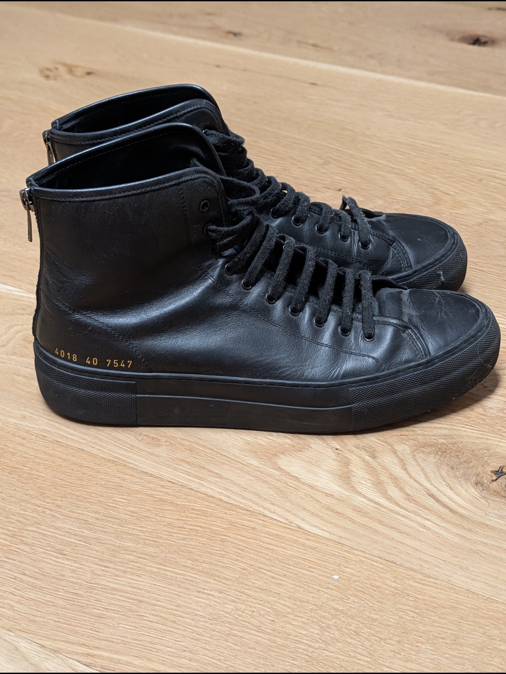 Woman's Common Projects Black Leather High-Top Sneakers